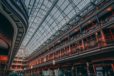 Low angle view of illuminated shopping mall