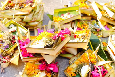 High angle view of religious offerings in boxes