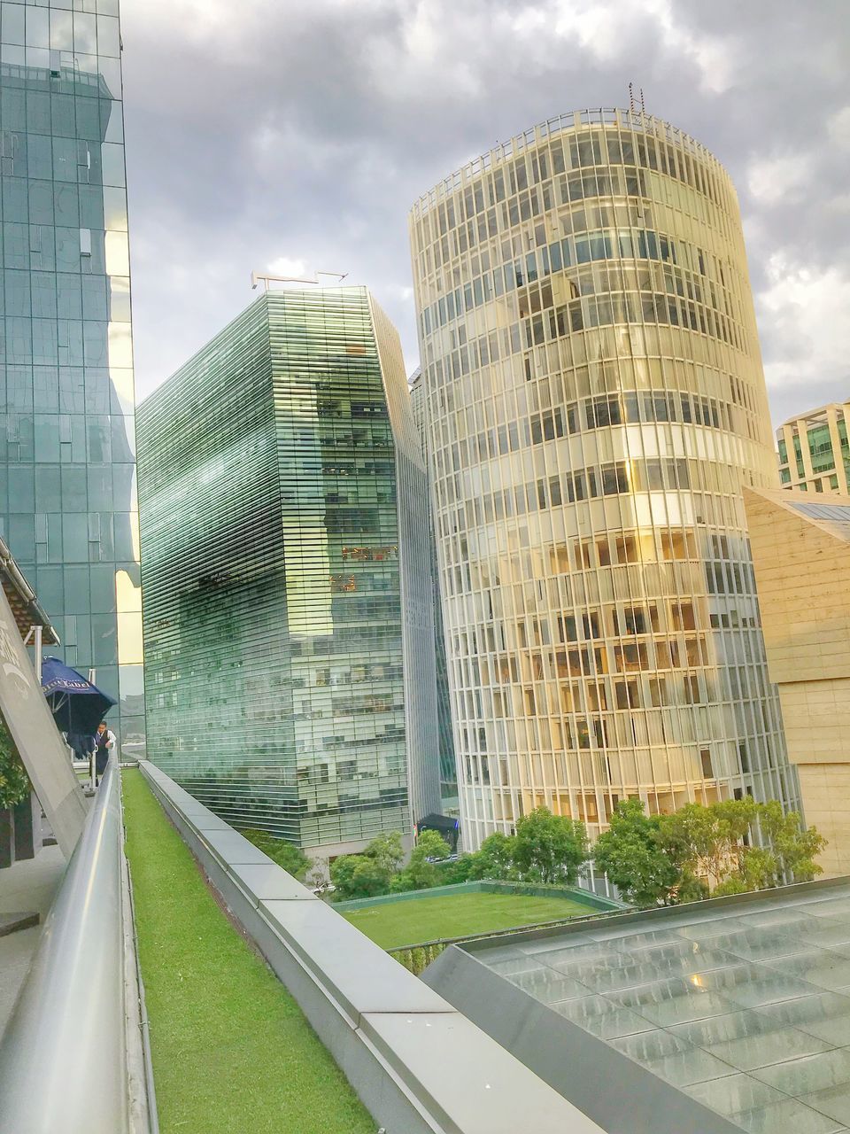 MODERN CITY BUILDINGS AGAINST SKY