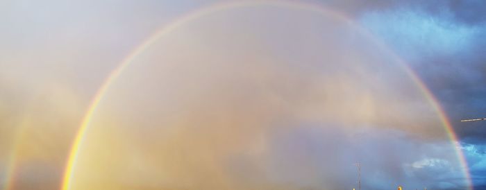 Low angle view of rainbow against sky