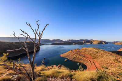 Scenic view of sea against clear blue sky