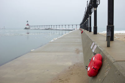 Lifeguard hut on beach against sky