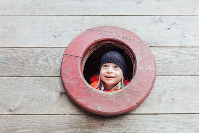 Portrait of happy boy peeking