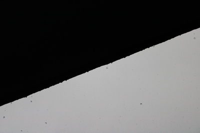 Close-up of window against black background