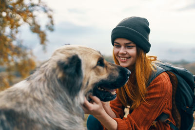 Portrait of a young woman with dog