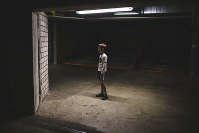 Full length of woman standing in corridor