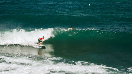 Man surfing on sea