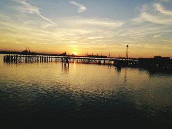 Scenic view of river against sky during sunset