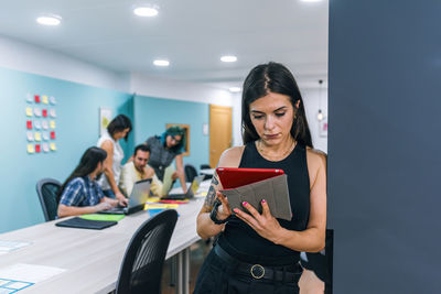 Young woman working on book