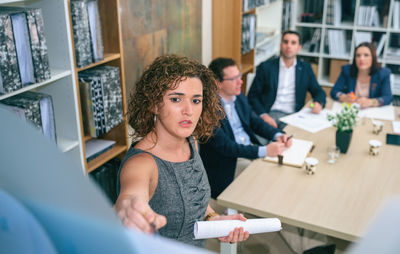 Portrait of friends working in office