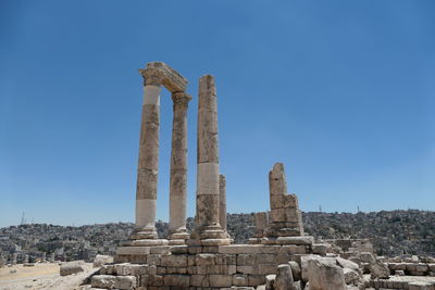 Old ruins of temple against clear blue sky