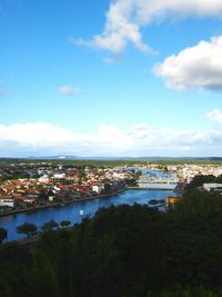 Cityscape against cloudy sky