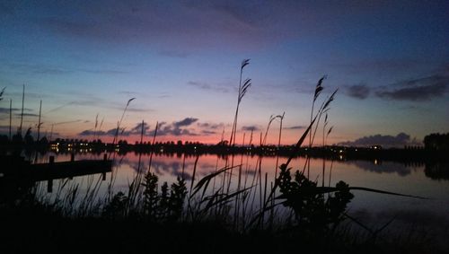 Scenic view of lake against sky during sunset