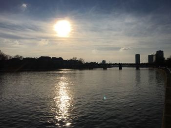 Scenic view of river at sunset