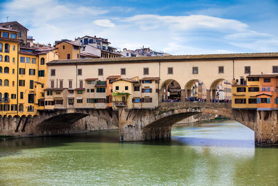 Ponte vecchio a medieval stone closed-spandrel segmental arch bridge over the arno river in florence