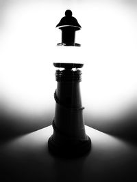 High angle view of bottle on table against white background