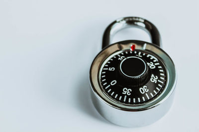 Close-up of clock on white background