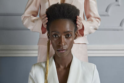 Portrait of young woman looking at camera