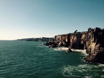 Scenic view of sea against clear blue sky