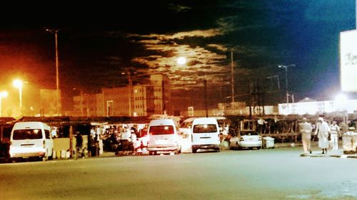 Cars on road in city at night