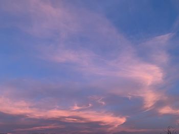 Low angle view of cloudy sky during sunset