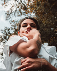 Portrait of woman touching cheek