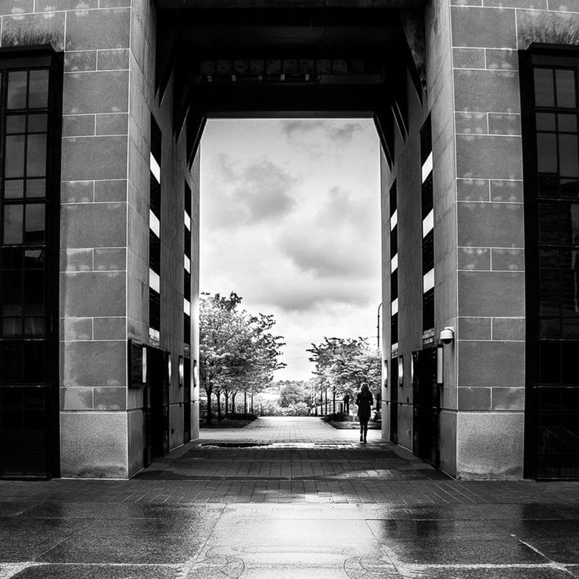 architecture, built structure, building exterior, the way forward, sky, building, window, diminishing perspective, empty, street, city, day, cloud - sky, narrow, no people, residential structure, residential building, cloud, road, outdoors