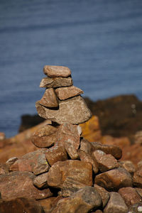 Close-up of stack of pebbles on beach