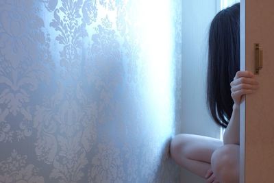 Man sitting by window