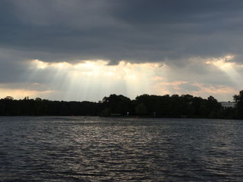 Scenic view of lake at sunset