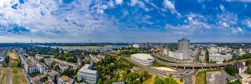 Panoramic view of city buildings against sky