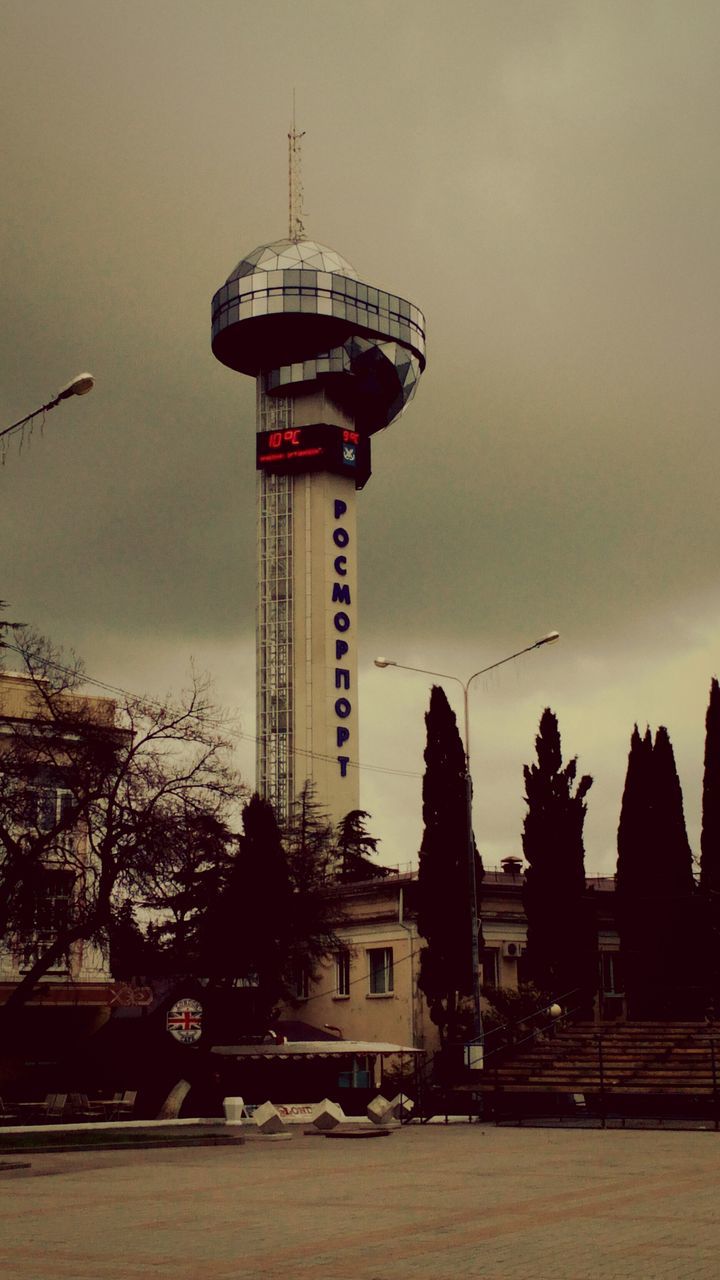 built structure, tower, sky, architecture, building exterior, no people, outdoors, sunset, amusement park ride, city, amusement park, tree, day