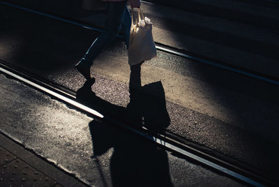 Low section of people walking on railway bridge