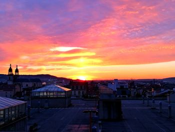 Cityscape against sky during sunset