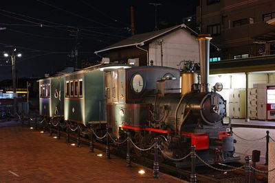 Locomotive at railroad station at night