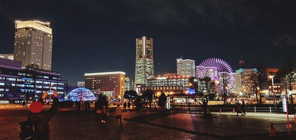 Illuminated buildings in city at night