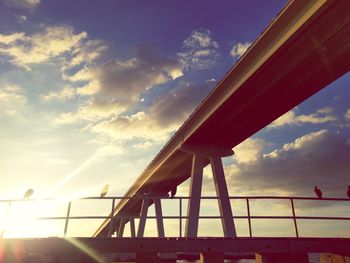 Low angle view of bridge against sky during sunset