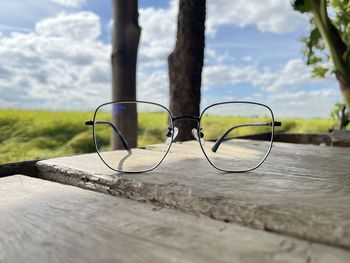 Close-up of eyeglasses on footpath