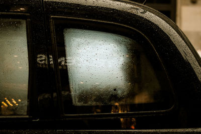 Close-up of wet car during rainy season