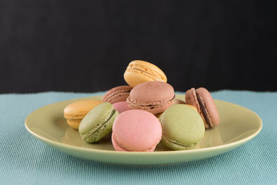 Close-up of macaroons in plate on table