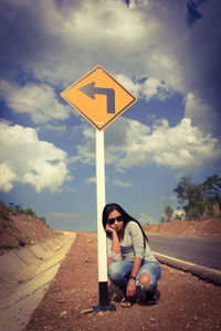 Full length of woman on road against sky