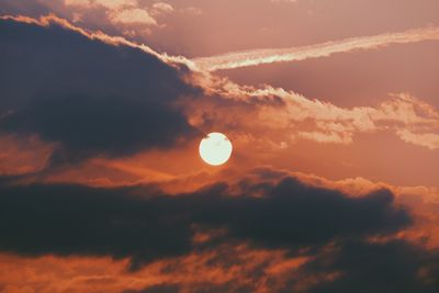 Low angle view of moon against sky at sunset