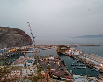 High angle view of boats moored in sea against sky