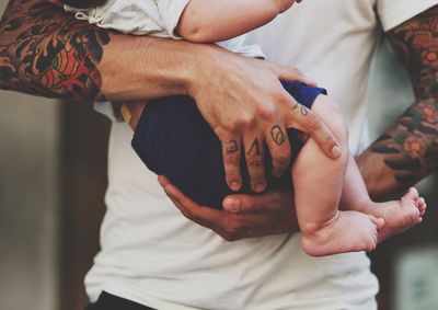 Close-up of young woman holding hands