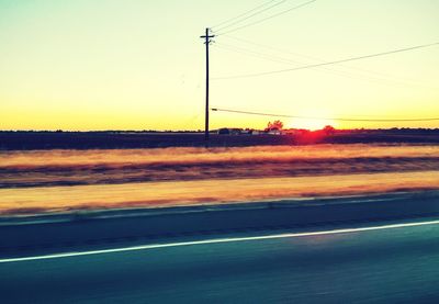 Scenic view of field against sky during sunset