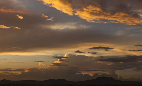 Low angle view of dramatic sky during sunset