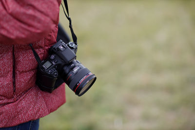 Close-up of woman photographing camera