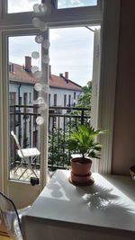 Table by window against sky