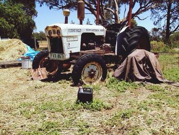 Abandoned tractor on field