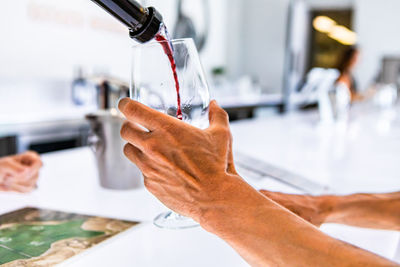 Close-up of person hand holding faucet